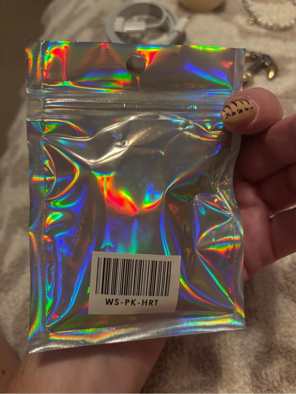 Velvet Caviar heart phone chain